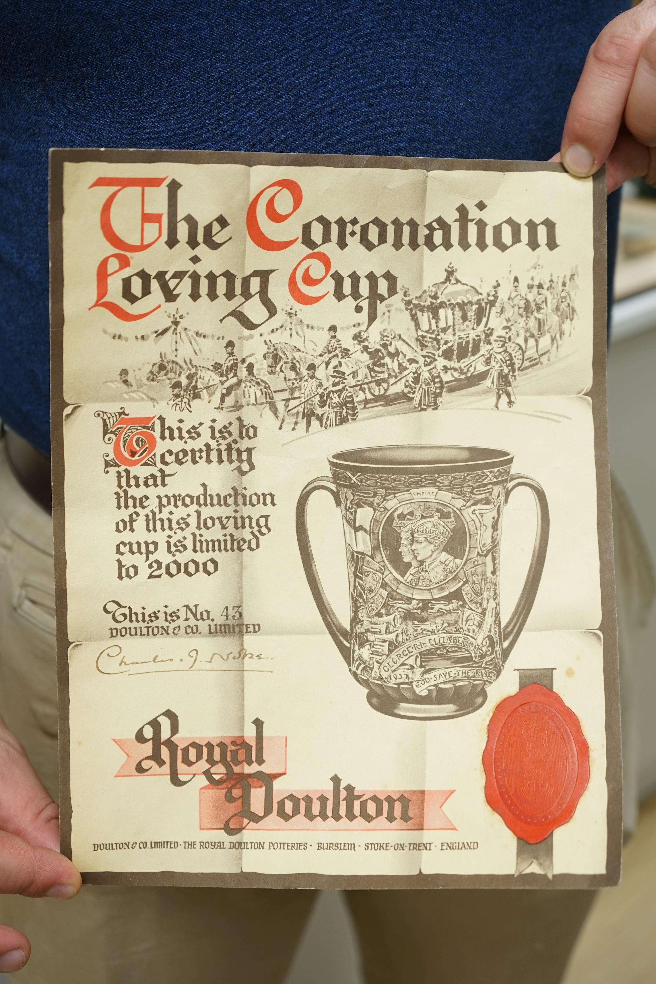 A Doulton commemorative cup, coronation of George VI and Elizabeth, 1937, with certificate signed by C.J. Noke, 26cm high. Condition - good